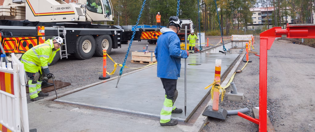 Workers installing a truck scale
