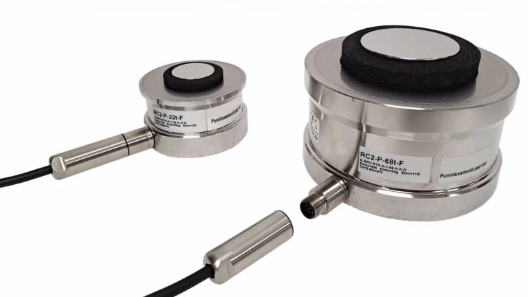 Two metal load cells on a white background