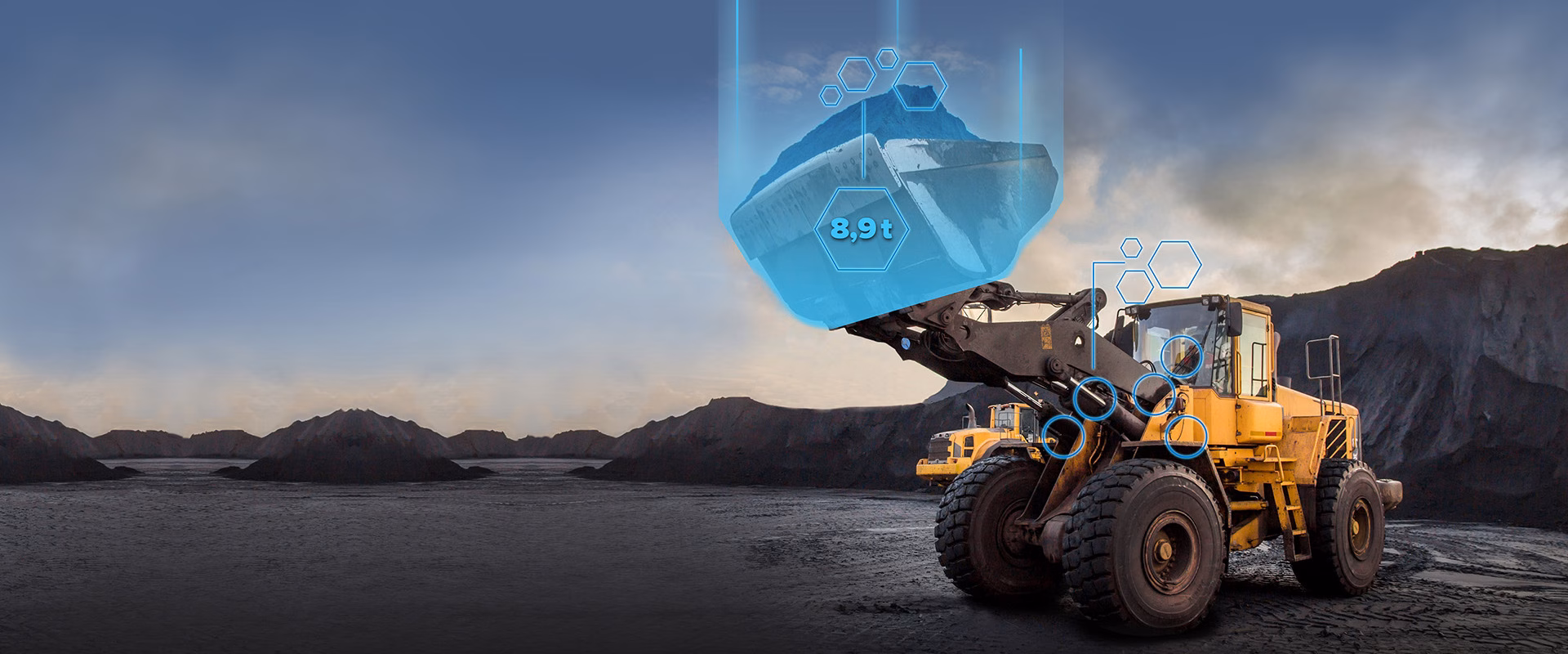 Wheel loader weighing material in a quarry with digital load data display (8.9 t)