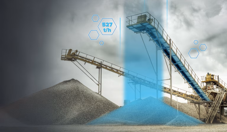 Belt conveyors above aggregate stockpiles with a cloudy sky in the background