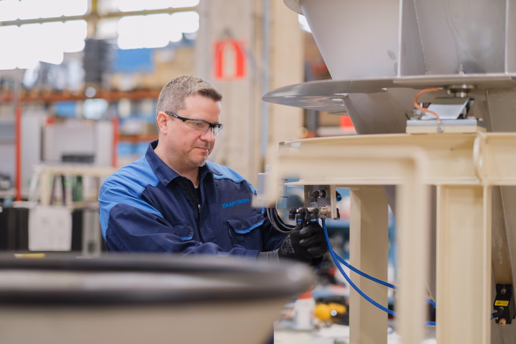 Tamtron technician assembling dosing equipment