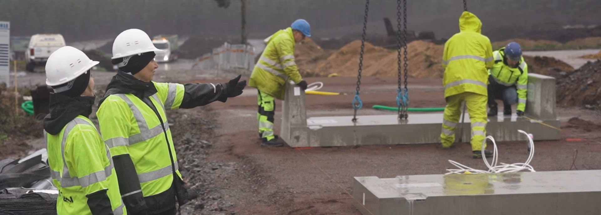 Workers installing a truck scale at a worksite