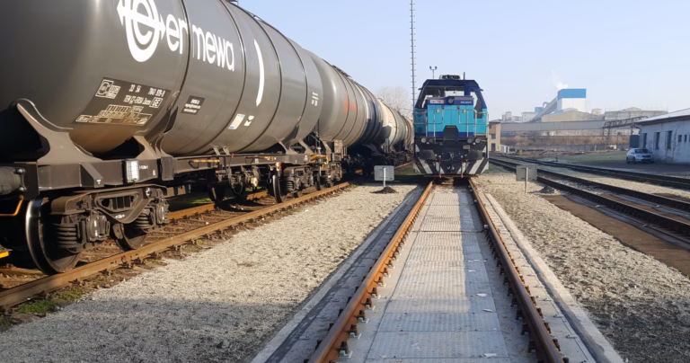 Freight train on railway tracks at an industrial site