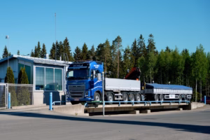 Truck on a surface-mounted concrete truck scale in an industrial yard