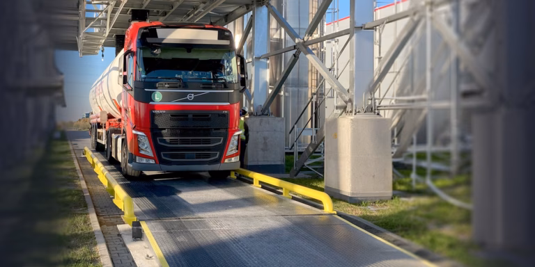 Tanker truck positioned on a truck scale at an industrial facility